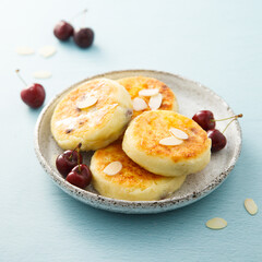 Banana cottage cheese cakes with cherries and almond