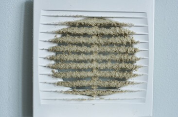 The dirty grille of a ventilation hood. Close-up.