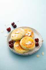 Banana cottage cheese cakes with cherries and almond