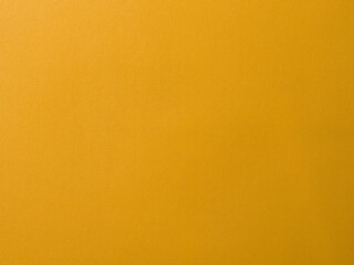 yellow leather texture background,blank orange leatherette texture background for poster cover banner header backdrop design with copy space