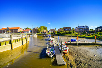 Surroundings at the harbor in the town of Tönning. Landscape in North Frisia with a view of the Eider River.	