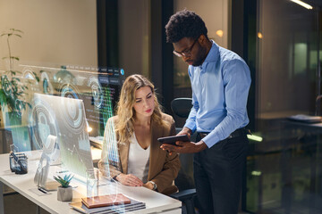 Modern Office Collaboration With Data Visualization Technology During Evening Work Hours Fostering Innovation