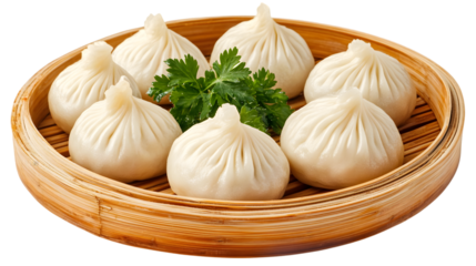 Steamed chinese soup dumplings in bamboo steamer with fresh parsley garnish.