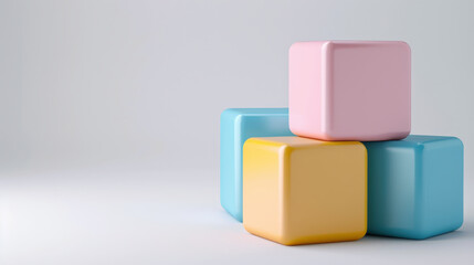 Obraz premium Three colorful cube blocks in pastel shades of pink, yellow, and blue are stacked in minimalist style against soft gray background, creating serene and modern composition