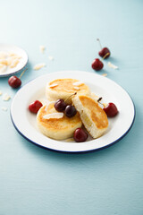 Banana cottage cheese cakes with cherries and almond
