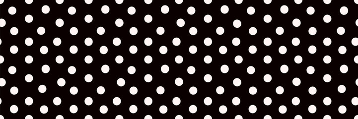 Abstract seamless pattern with polka dot ornament made in black and white color.