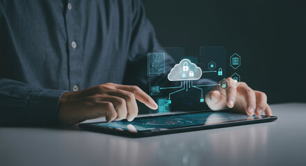 Man using tablet with cloud computing and data security hologram