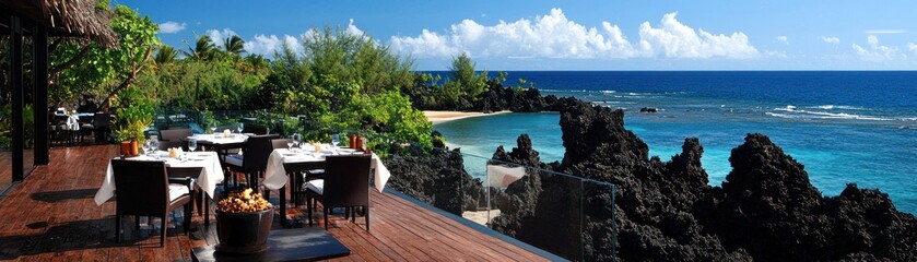 An open air restaurant overlooking a beautiful ocean view