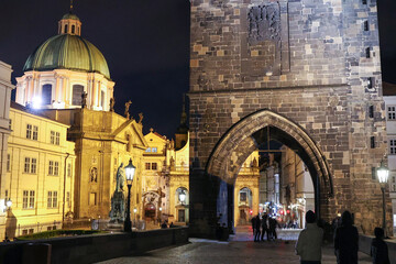 Charles Bridge in Prague with St. Nicholas' Cathedral in the Night.