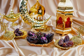 Ramadan kareem composition with various dates on golden fabric background.