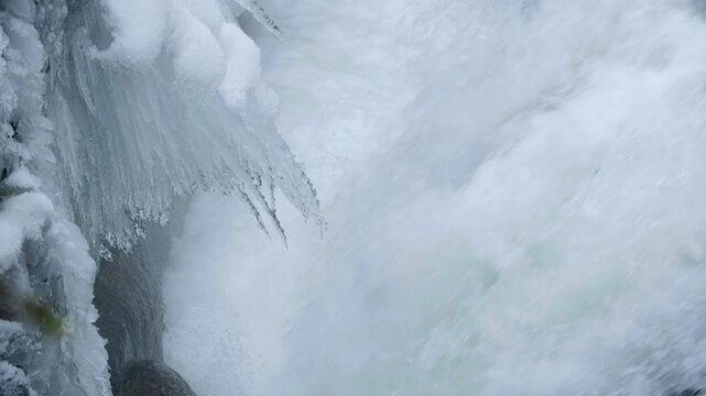 Winter Season Elements of Nature with Icicles Hanging Over Waterfall