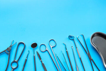Medical equipment and surgical instruments on a blue background, top view
