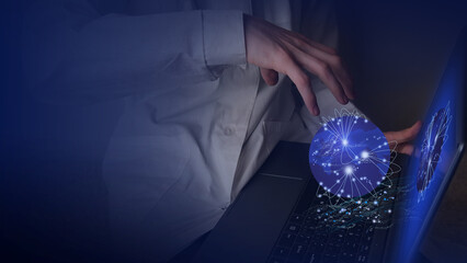 Digital visualization of big data of global processes on the planet. Human hand over laptop keyboard.