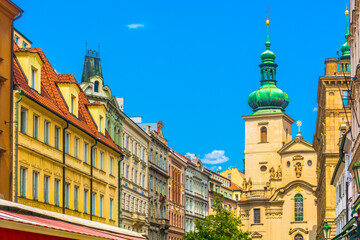 View of the architectural details of the Church of St. Gall, showcasing its intricate facade, and surrounding street with notable landmarks that reflect the rich cultural heritage of the area