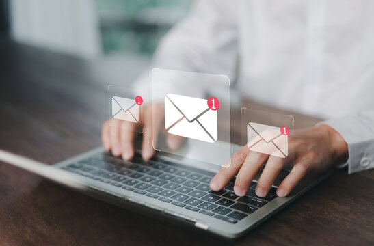 New email notification concept, business online communication, email communication, digital marketing, businessman responding to floating digital interface showing new email notification symbol.	
