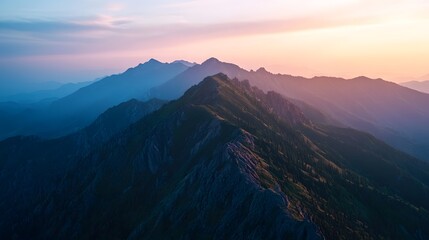 Fototapeta premium A rugged mountain ridge lit by the soft interplay of twilight shadows and warm glows. 