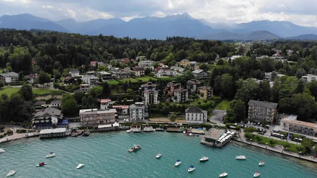 Worthersee mountain lake in Austrian Alps. Austria landscape in State of Carinthia. Town of Velden am Worther See. Drone point of view.