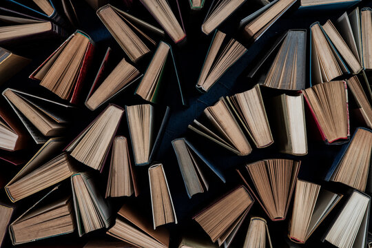 Book background. Lots of vintage books creating texture for the design. Library concept, classic literature.