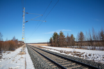 Fototapeta premium Empty train tracks in early springtime, Kempele Finland