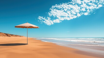 Fototapeta premium Brown beach umbrella against clear blue sky on sunny day
