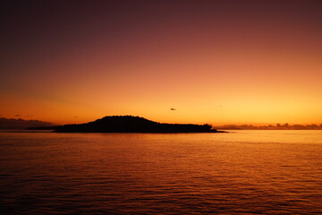 A stunning orange sunset over the calm Indian Ocean, Africa