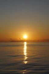 A stunning orange sunset over the calm Indian Ocean, Africa