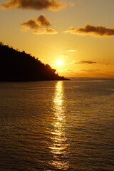 Obraz premium A stunning orange sunset over the calm Indian Ocean, Africa