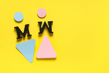 Female and male figures with letters on yellow background