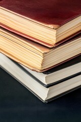 Fototapeta premium Close-up Stack of Vintage Hardback Books Leather Bound Old Books