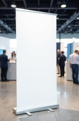 In the foreground is roll up banner blank mock up against the backdrop of a blurry technology exhibition.