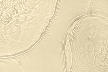 Texture of clean water with ripples on light yellow background