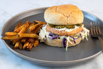 salmon burger served with home made french fries