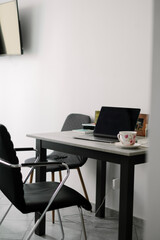 Remote work desk with laptop.