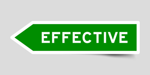 Green color arrow shape sticker label with word effective on gray background