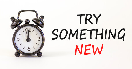 Try something new symbol. Concept words Try something new on beautiful white paper. Alarm clock. Beautiful white paper background. Business motivational lifestyle try something new concept. Copy space