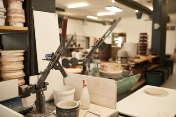 Mold sitting on a bench in a large ceramics manufacturing studio
