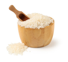 Wooden bowl and scoop with raw rice isolated on white background
