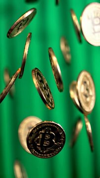Bitcoin coins falling against a green background, showcasing the digital currency amidst a dynamic setting filled with movement and shine. Ideal for Social Media, Stories, Advertising