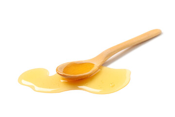 Wooden spoon with spilled honey isolated on white background, closeup