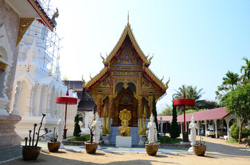 Ancient ordination hall or antique old ubosot for thai travelers people travel visit and respect praying blessing buddha wish myth at Wat Khua Khrae temple on February 22, 2015 in Chiang Rai Thailand