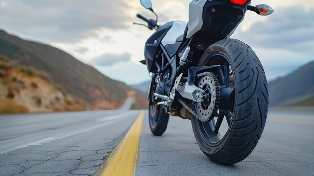 Motorcycle adventure on open road scenic landscape action shot dynamic environment low angle view freedom concept