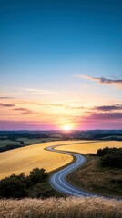 Fototapeta premium Scenic Sunset Road Golden Fields Winding Country Lane Vibrant Sky
