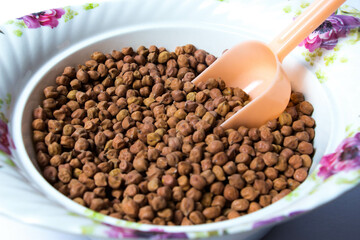 Organic Brown Chickpeas in a scoop. Black chickpeas, also known as kala chana, Bengal gram,Egyptian pea.