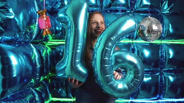 Number 16 16th Birthday sixteen Party Blue Foil Balloons and Disco ball in a Shiny Party Scene