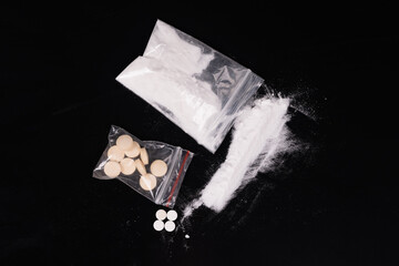 Syringe with drugs dose on black background. Narcotic substances in spoon. powder in plastic bag. Drugs concept on dark place. Heroin narcotic crime. Danger addict problem criminal