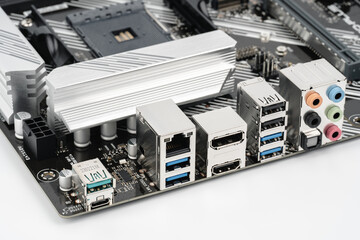 The back of a modern motherboard with a large set of ports for connecting peripheral equipment for...