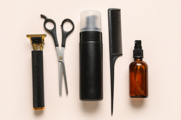 Set of male shaving accessories on beige background