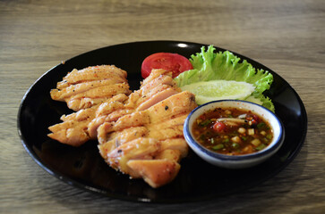 Traditional thai or local cuisine meal food baked grilled and roasted steak chicken with Jaew sauce...