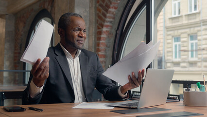 African American adult manager male guy in office ethnic businessman stressed puzzled angry furious...