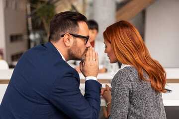 Office Workers Sharing Secrets During a Private Discussion